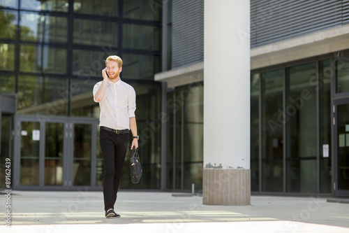 Young businessman with mobile phone