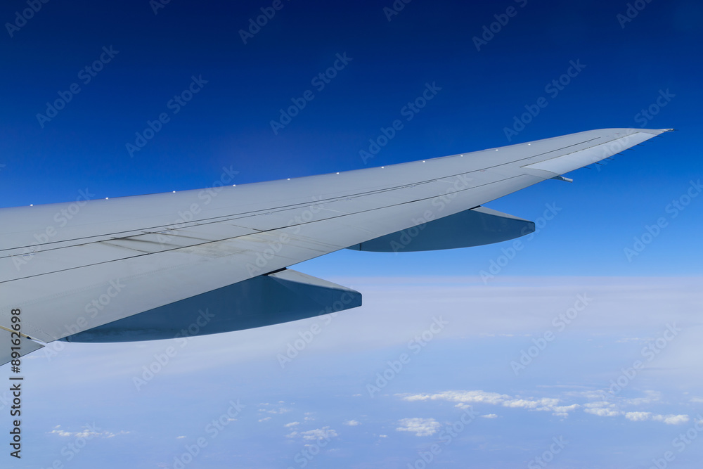Aircraft wing on the clouds,flying background Aircraft wing on the clouds,flying background