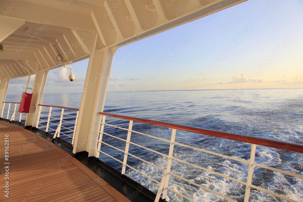 Looking out the Stern of a Cruise Ship as the Sun sets