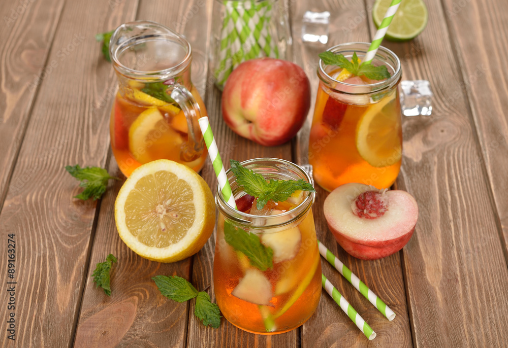 Ice tea with lemon, peach and mint