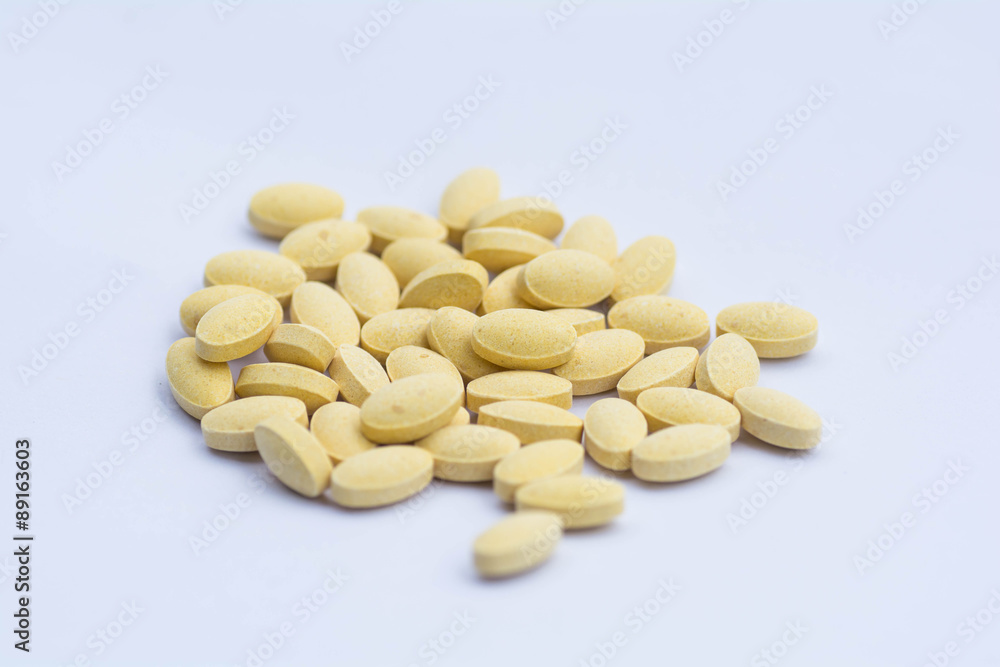 Vitamin C tablets on a white background. Vitamin C tablets on a white background.