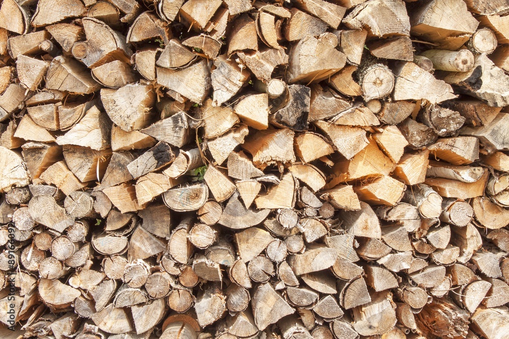 Ready firewood. Various kinds of wooden logs stacked on top of each other. Stack of wood, firewood, background. Dry chopped firewood logs ready for winter.
Ready firewood. Various kinds of wooden logs stacked on top of each other. Stack of wood, firewood, background. Dry chopped firewood logs ready for winter.
