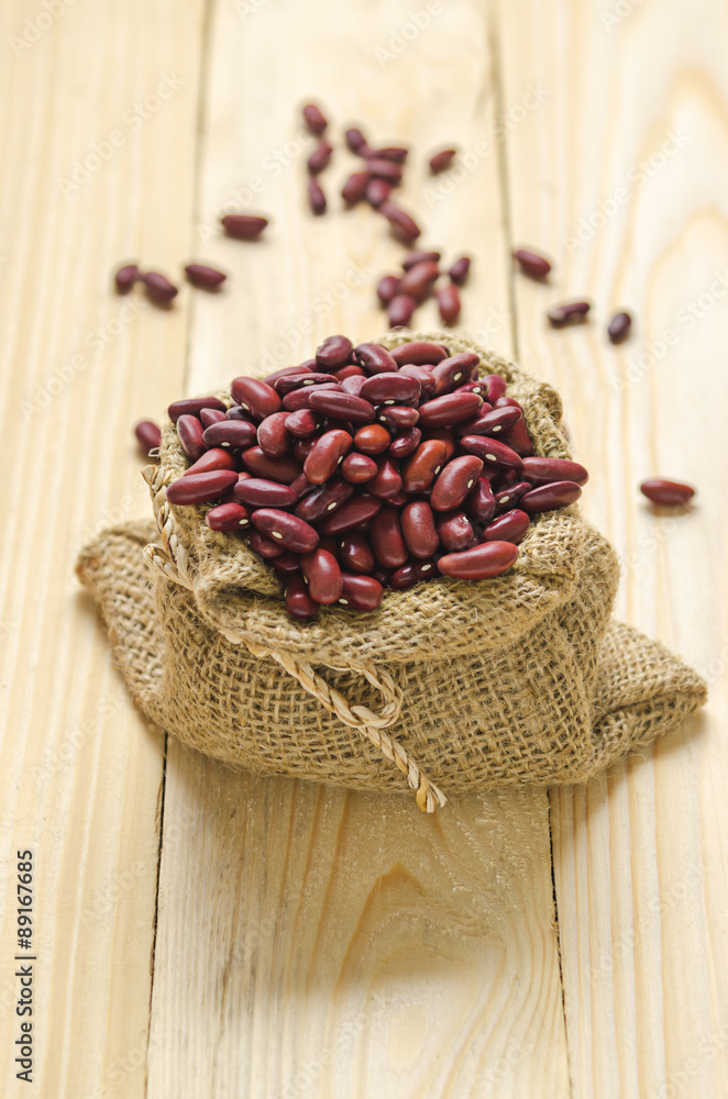 beans in sack on wood table beans in sack on wood table