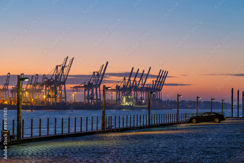 Cargo terminal in Port of Hamburg at dusk, Germany