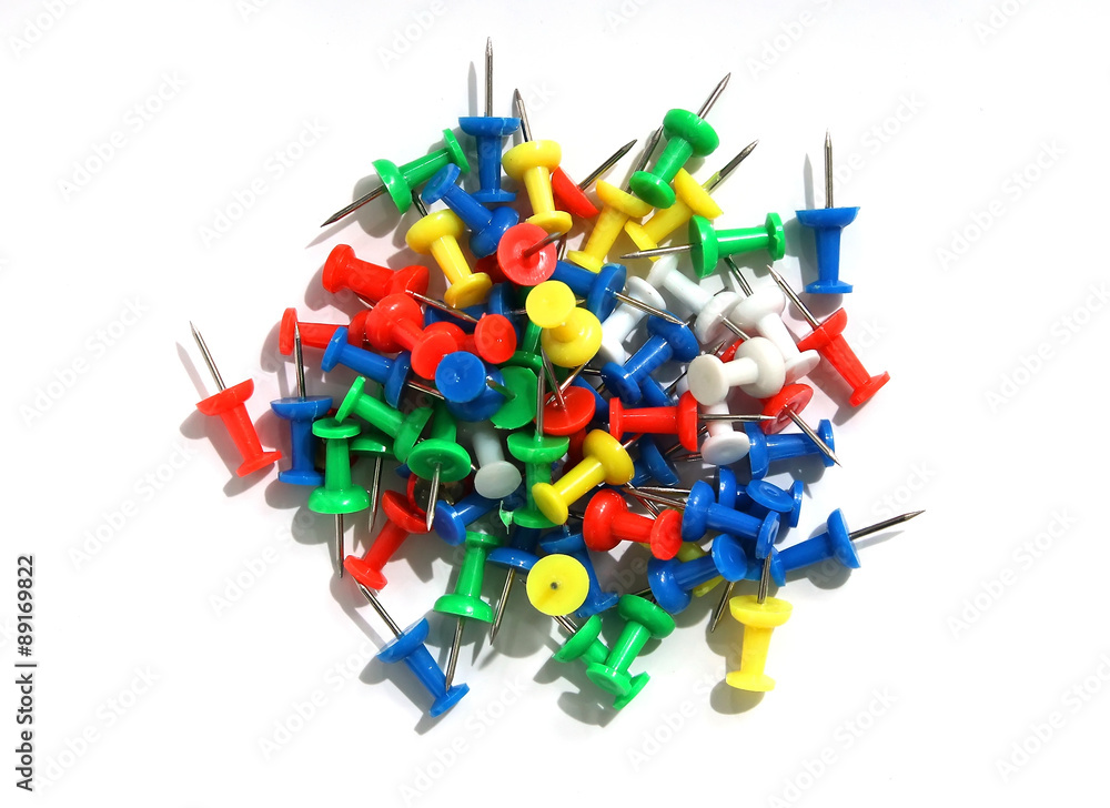 Push pins on a white background