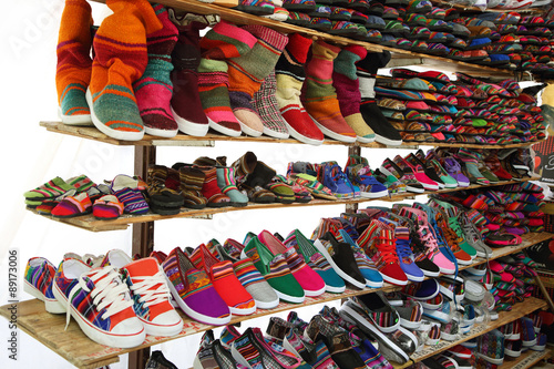 Market stall with colorful indigenous shoes, Argentina
