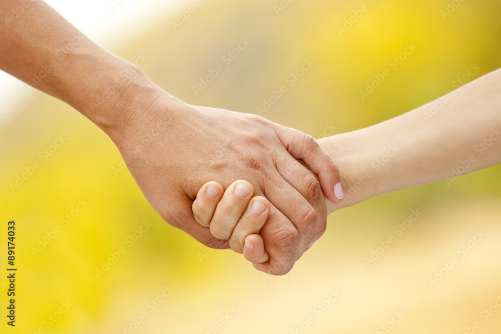 Mother holds a child's hand Mother holds a child's hand