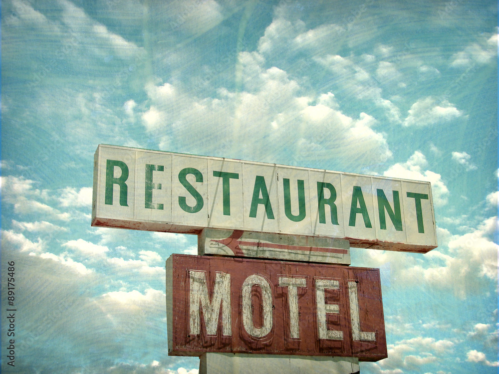 aged and worn vintage photo of restaurant and motel sign