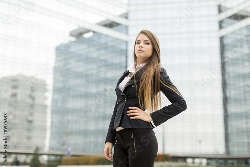 Business woman in front of office building