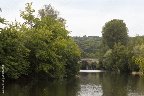 River La Vezere. The river La Vezere runs through a small fertile valley in the Dordogne region of France.