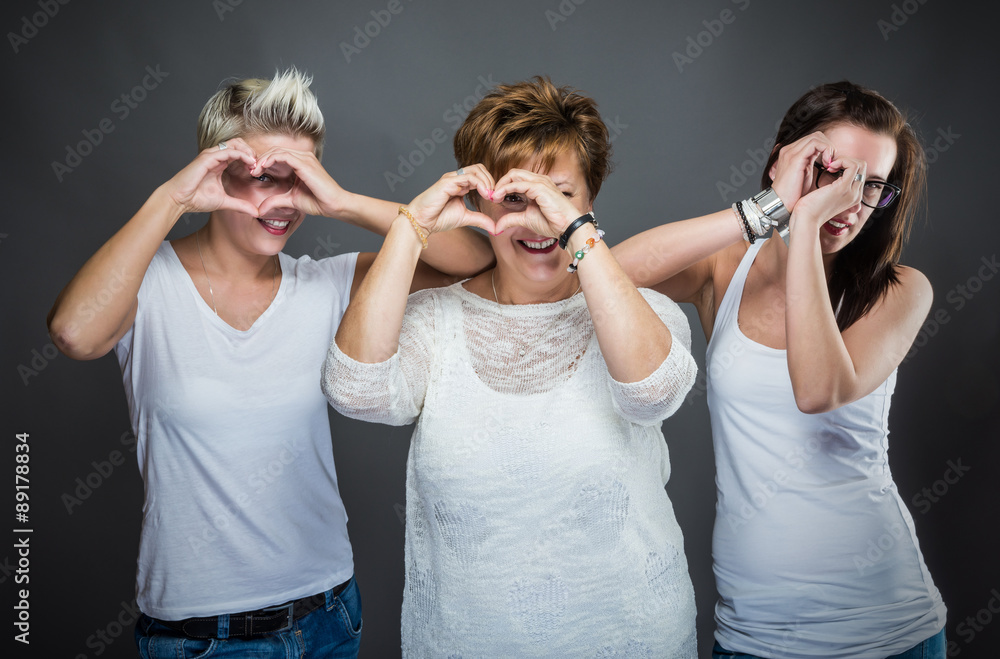 Happy family with mothr and daughters. Studio shot. Happy family with mothr and daughters. Studio shot.
