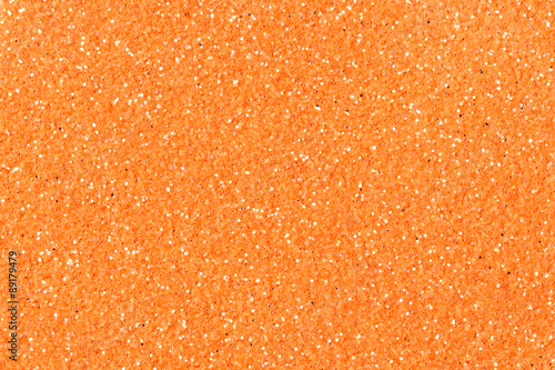 Orange glitter texture christmas background.