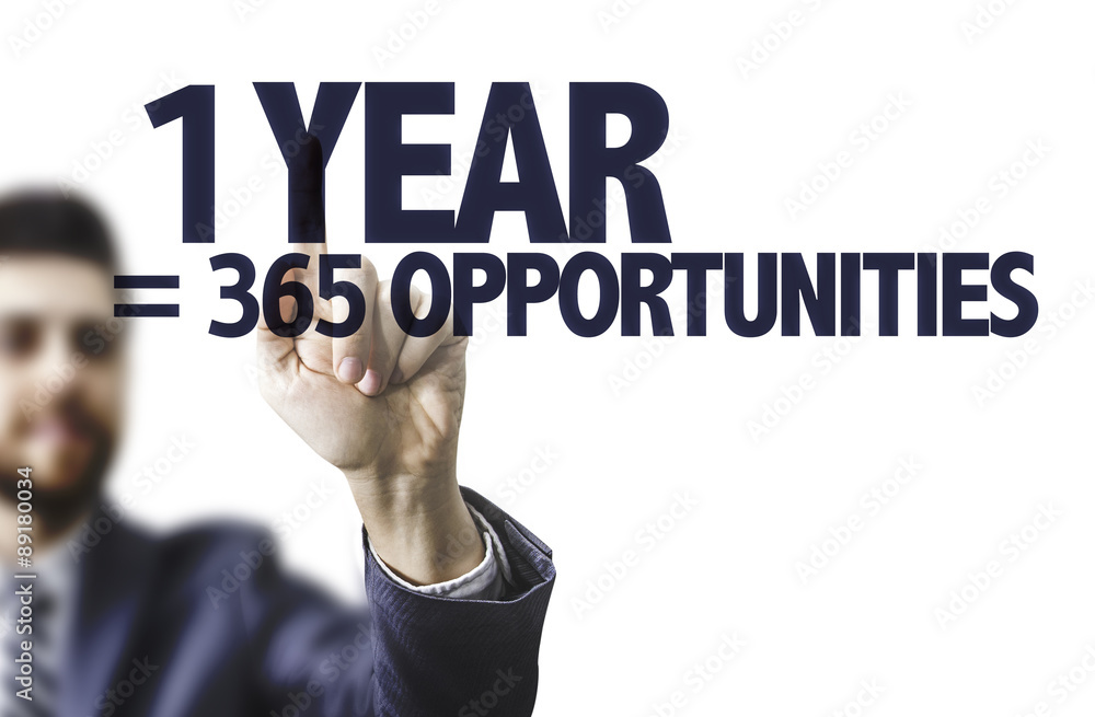 Business man pointing the text: 1 Year = 365 Opportunities Business man pointing the text: 1 Year = 365 Opportunities
