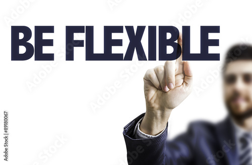 Business man pointing the text: Be Flexible