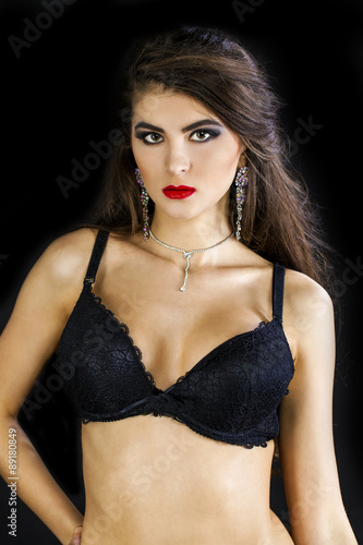 Fashion portrait of a professional model in black sexy underwear © Andrey_Arkusha