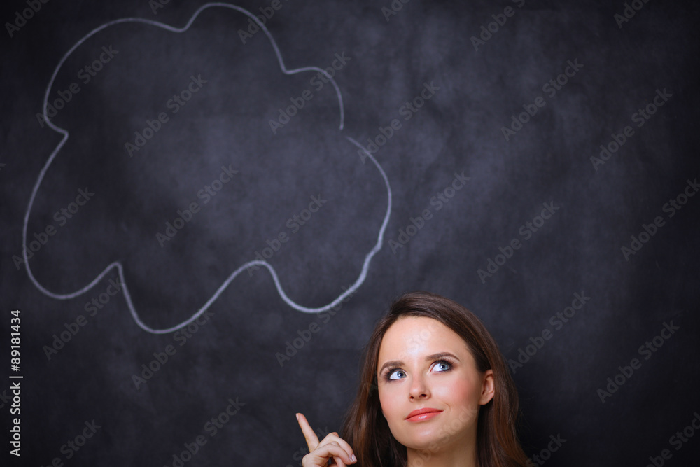 portrait of attractive girl thinking and pointing up to blank portrait of attractive girl thinking and pointing up to blank