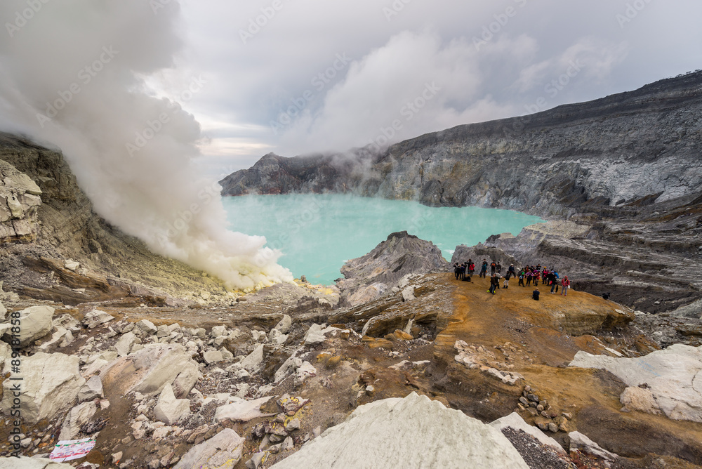 unidentified tourist taking view at Kawah Ijen volcano crater
