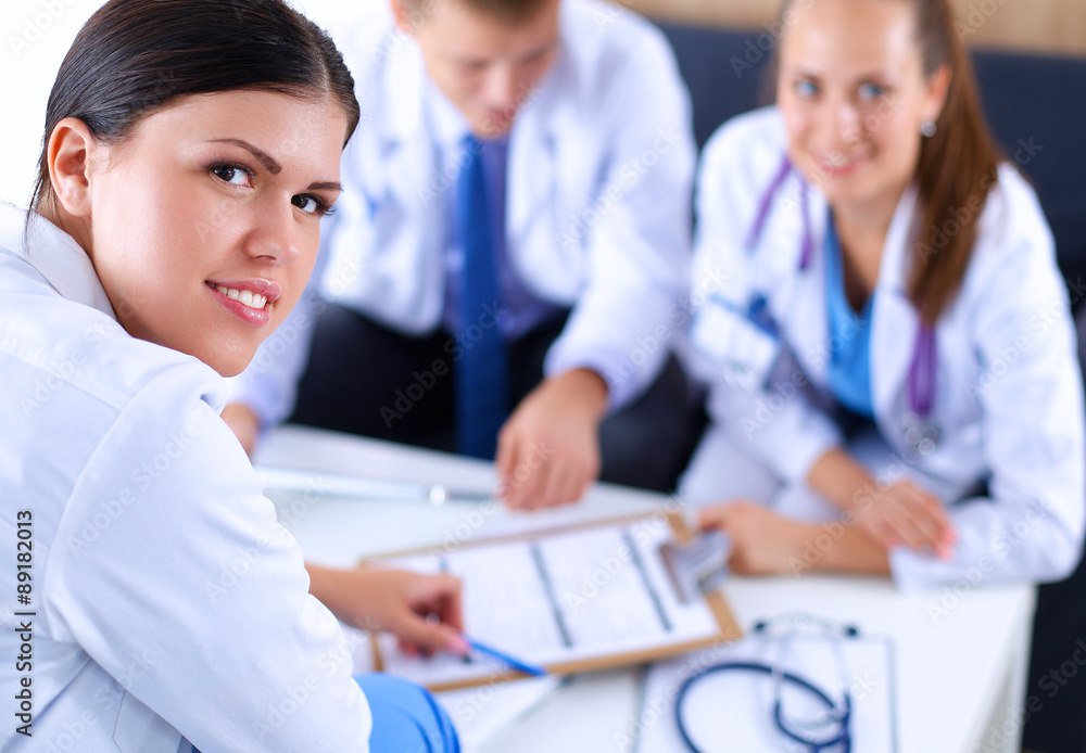 Happy medical team discussing and working together Happy medical team discussing and working together