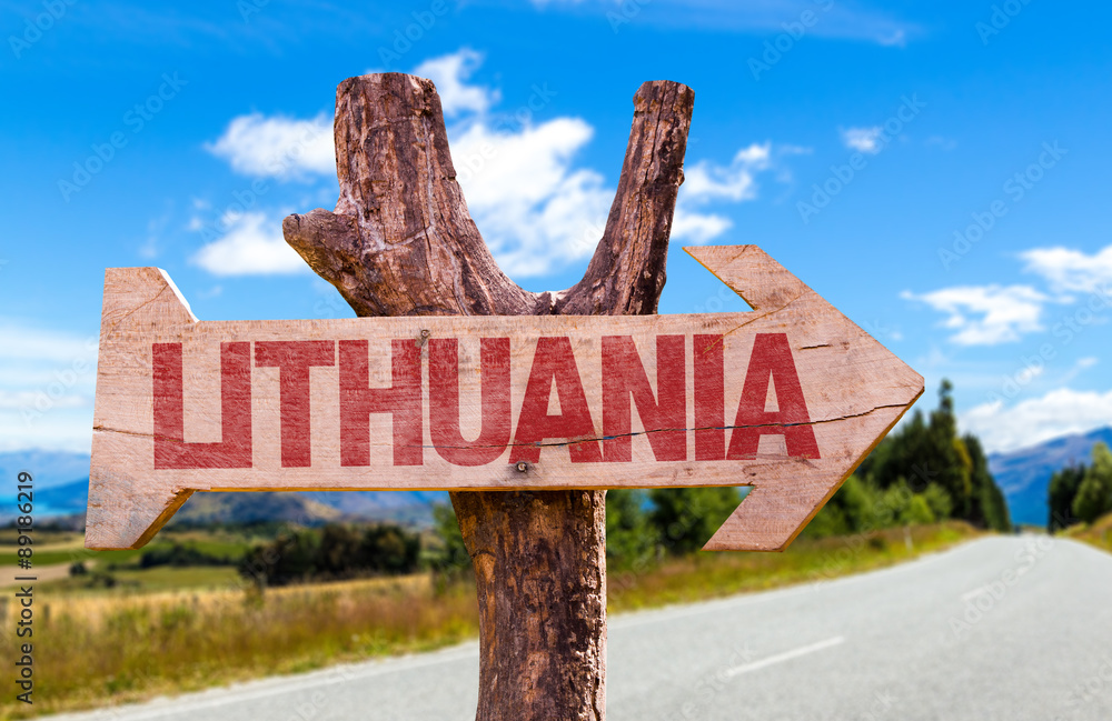 Lithuania wooden sign with road background