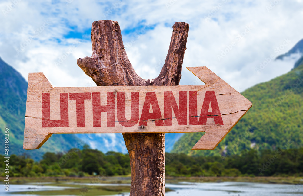 Lithuania wooden sign with mountains background