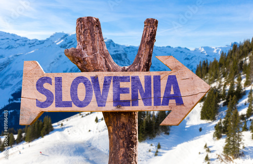 Slovenia wooden sign with winter background