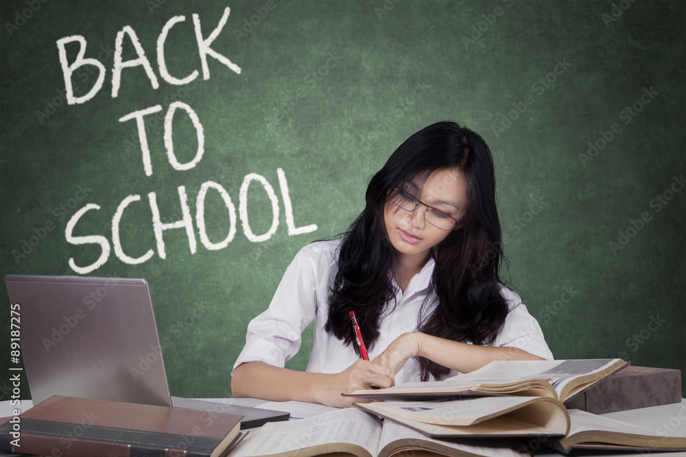 Teenage student back to school and studying in class Teenage student back to school and studying in class