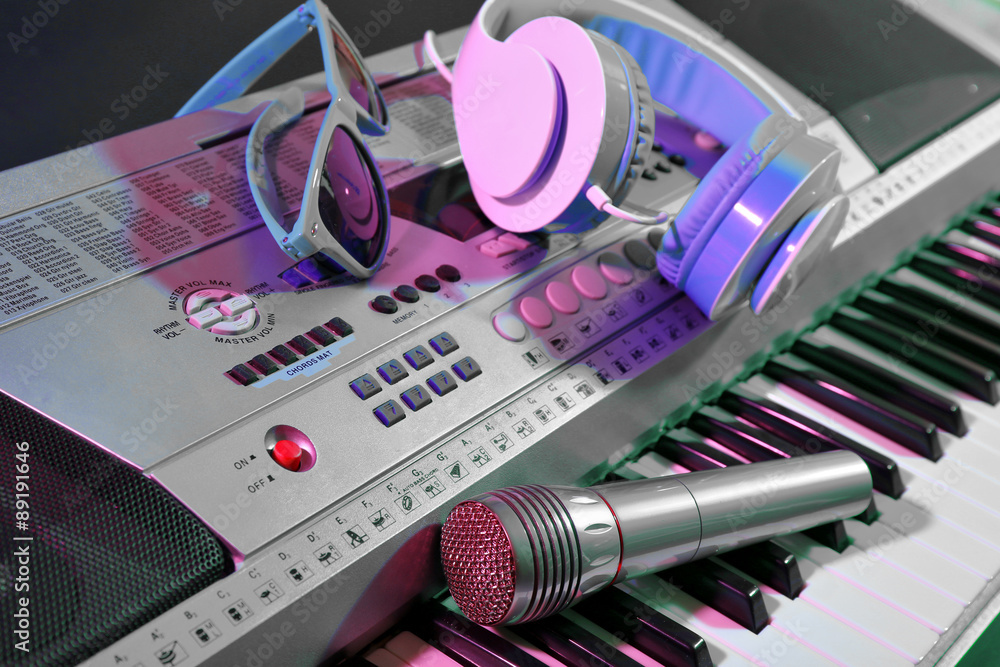 Headphones with microphone on synthesizer close up Headphones with microphone on synthesizer close up