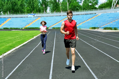 Young people jogging on stadium