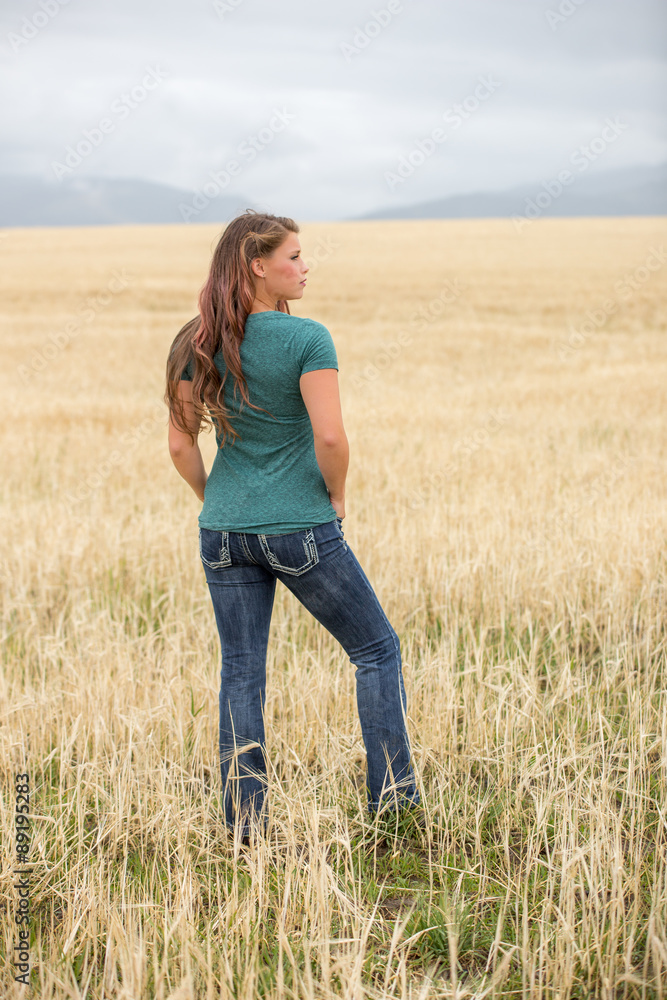 Young woman posing in wheat field. Young woman posing in wheat field.