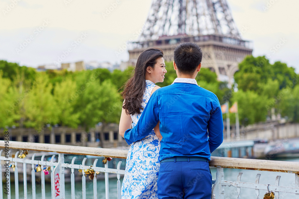 Young romantic Asian couple in Paris, France