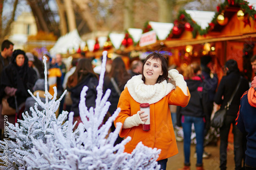 Happy young girl on a Parisian Christmas market