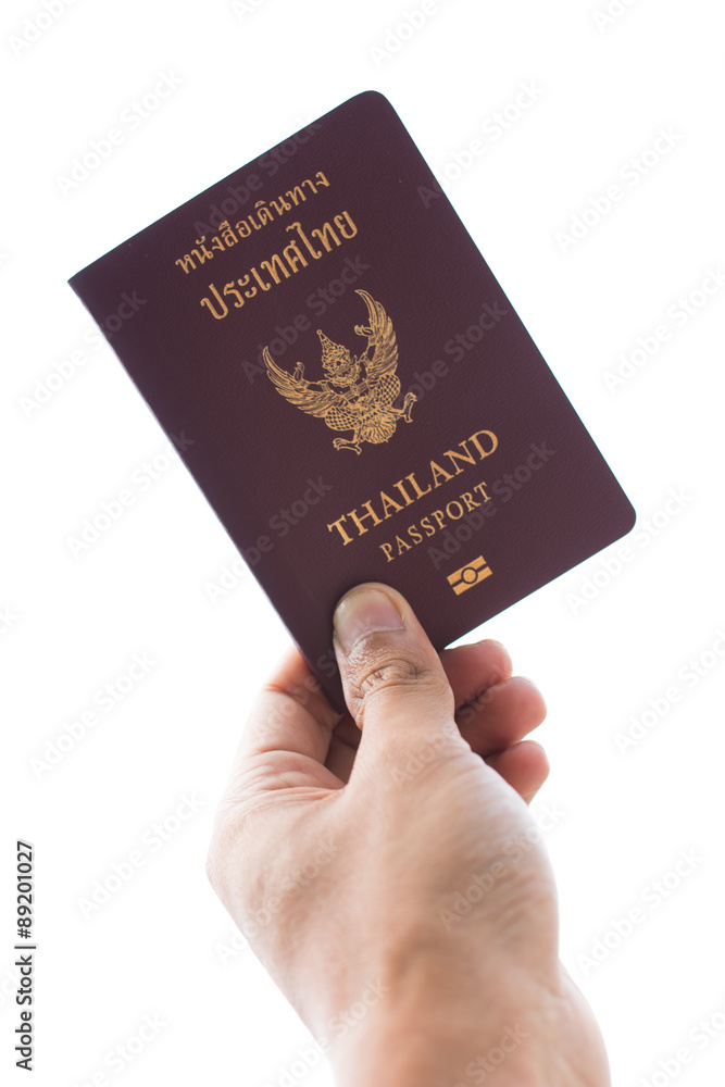 Thailand Passport and hand on white background Thailand Passport and hand on white background