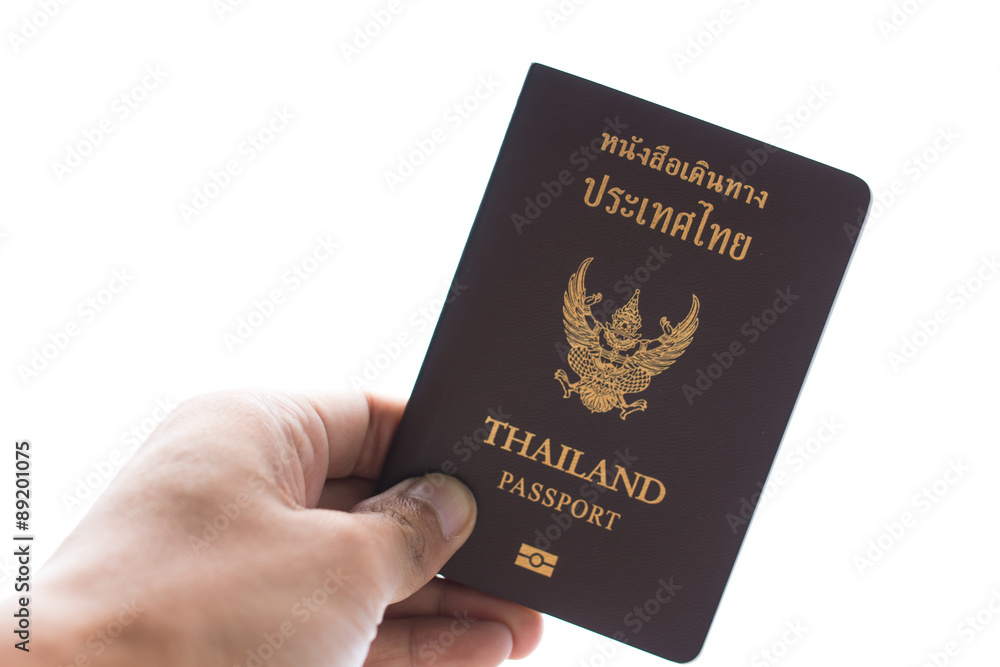 Thailand Passport and hand on white background Thailand Passport and hand on white background