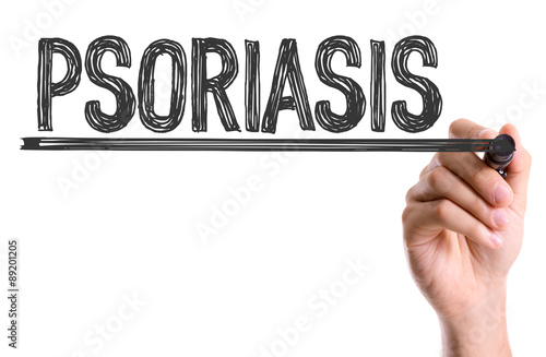 Hand with marker writing the word Psoriasis