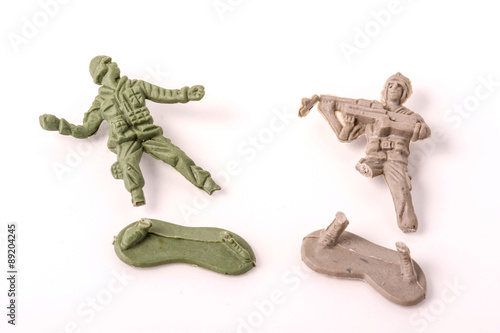 Broken Plastic Toy Soldiers on white background