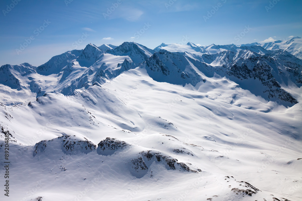 Winter snow covered mountain peaks in Austrian alps