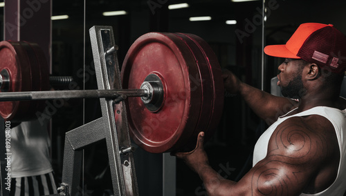 Weight training African doing bodybuilding