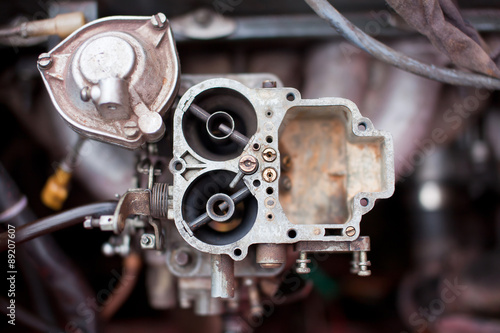 Dirty rusty carburetor of old russian car photo