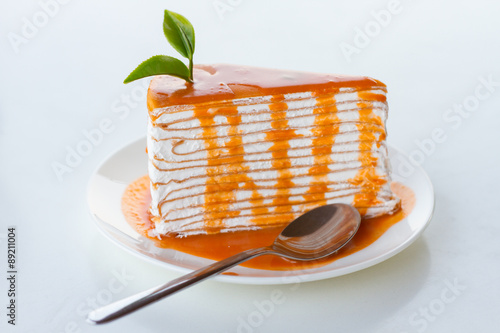 Thai tea crape cake on white background photo