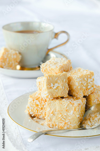 Golden marshmallow cubes with coconut bits