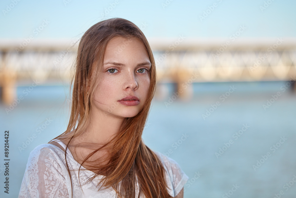 Portrait beautiful young girl on the background of water. Portrait beautiful young girl on the background of water.