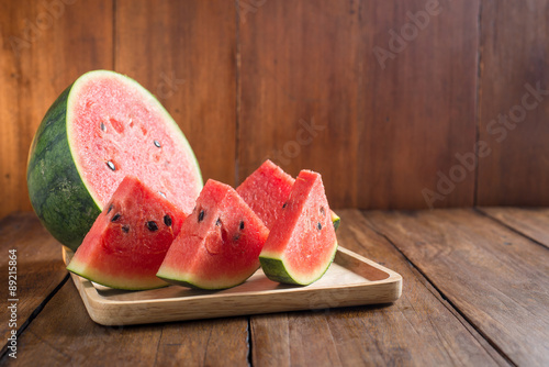 slices watermelon on wooden background