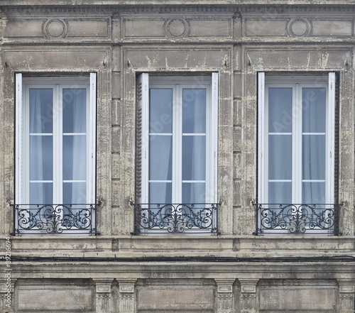 Three French Doors. In large cities in the traditional buildings, french doors are found everywhere. Complimenting the doors are black wrought iron railings.