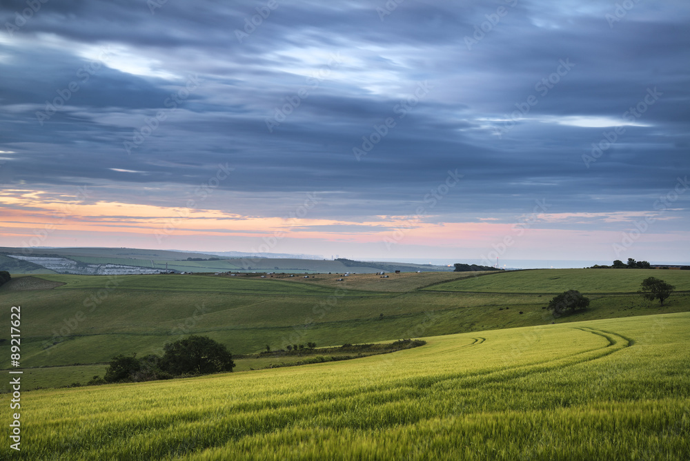 Beautiful Summer sunset landscape Steyning Bowl on South Downs