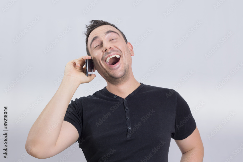 Man laughing on a cell phone Man laughing on a cell phone