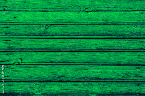 Green peeling paint wooden surface.