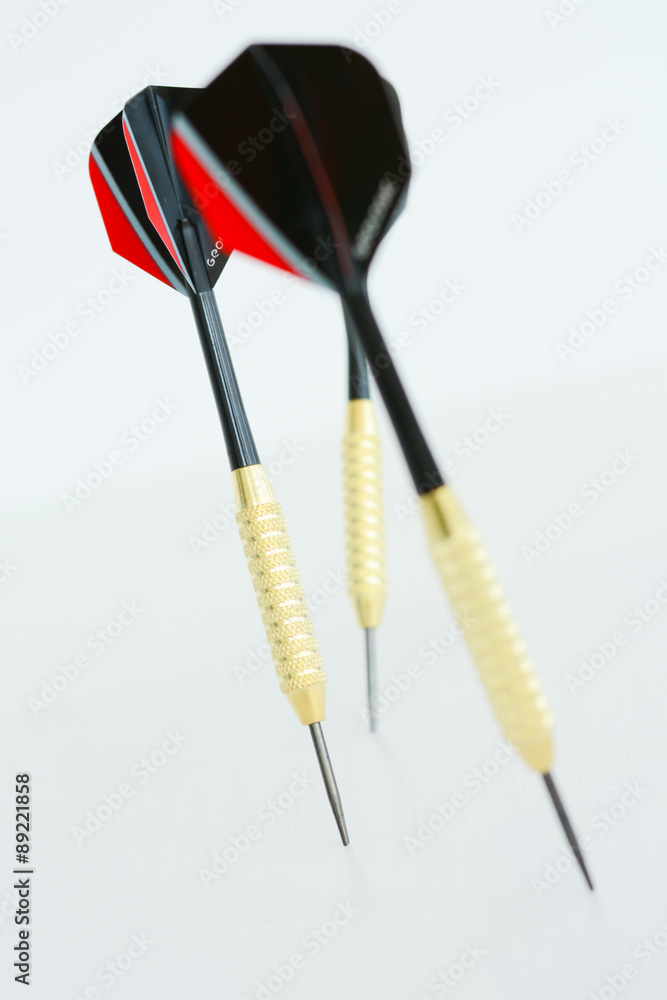 Dart arrows on white background suggesting business vision and strategy concept Dart arrows on white background suggesting business vision and strategy concept