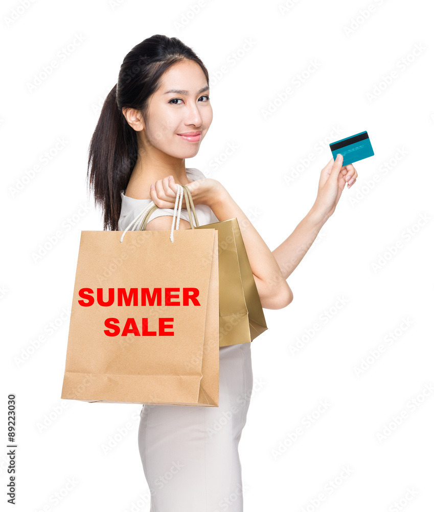 Happy shopping woman credit card and shopping bag for showing su Happy shopping woman credit card and shopping bag for showing su