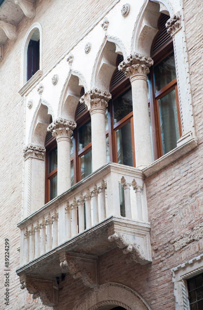View of a balcony and columns of Cavalloni Thiene Palace in the historical Contrà  Porti Street of Vicenza