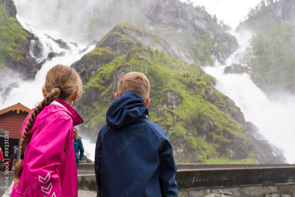 Kids looking at waterfalls